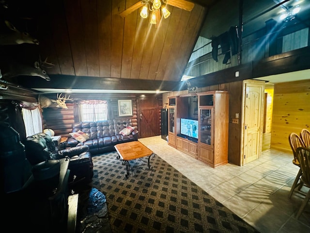 tiled living room featuring high vaulted ceiling, ceiling fan, and wooden walls