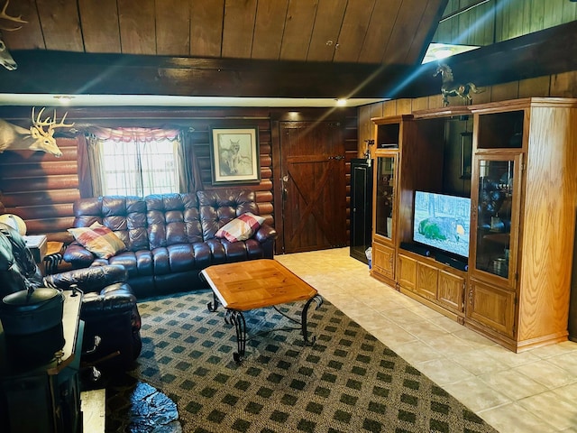 living room with light tile patterned floors, wood ceiling, a barn door, wood walls, and log walls