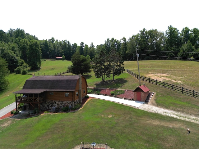 birds eye view of property with a rural view