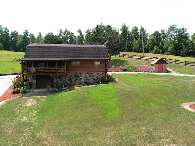 view of yard with a rural view