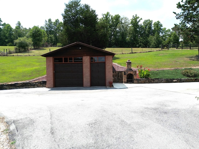 garage with a yard