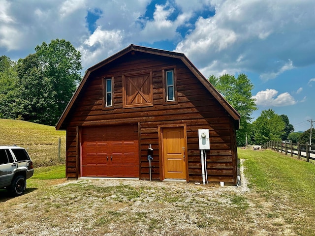 garage with a lawn