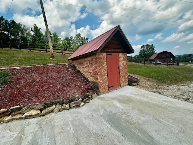 view of outdoor structure with a lawn