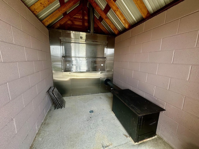 bathroom featuring lofted ceiling