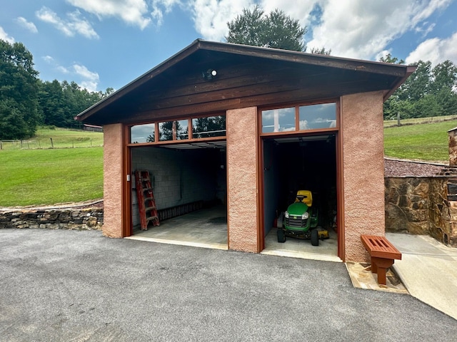 garage with a lawn