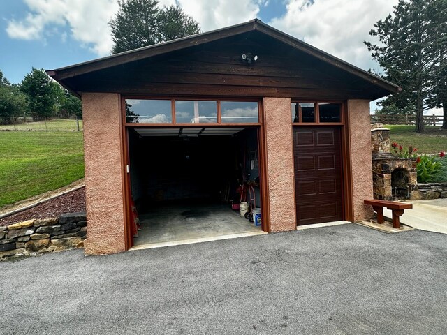 garage with a yard