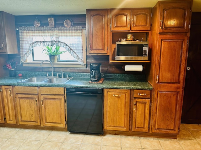 kitchen featuring light tile patterned floors, dishwasher, and sink