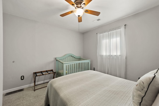 carpeted bedroom with ceiling fan