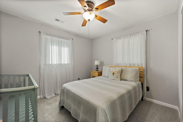 carpeted bedroom with ceiling fan