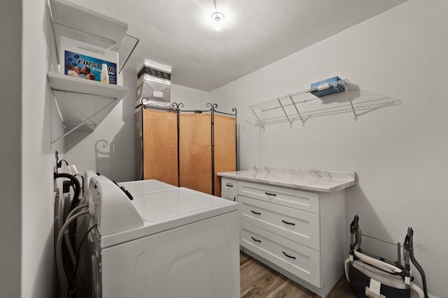 laundry room with dark hardwood / wood-style flooring and separate washer and dryer