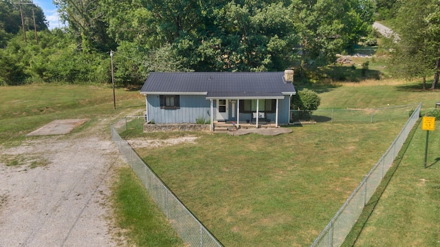 view of front of property with a front yard and covered porch