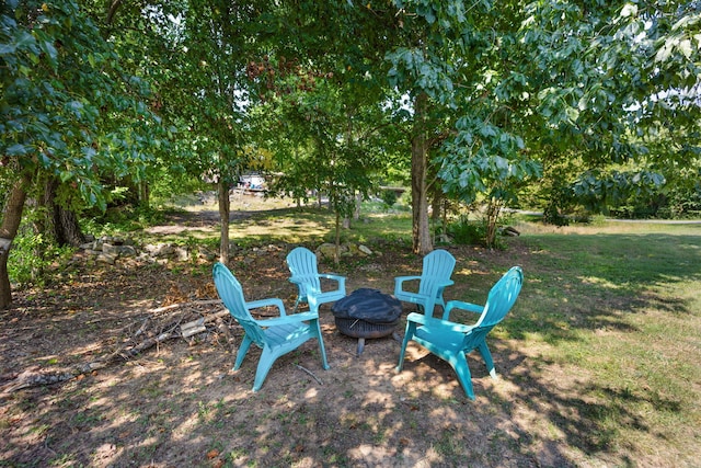 view of yard featuring a fire pit