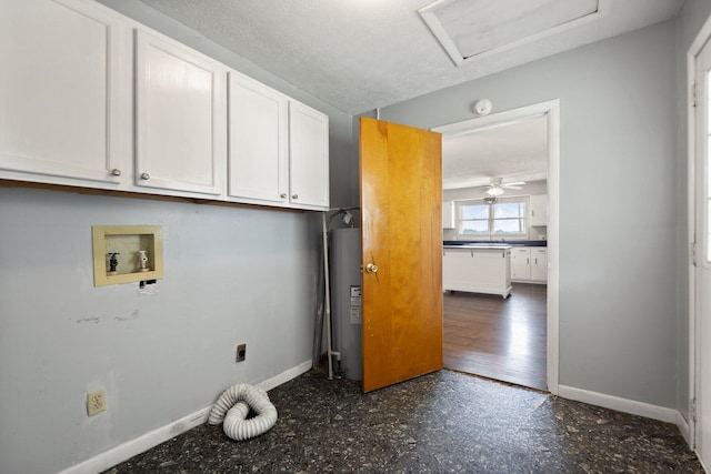 laundry area featuring washer hookup, cabinet space, hookup for an electric dryer, and baseboards