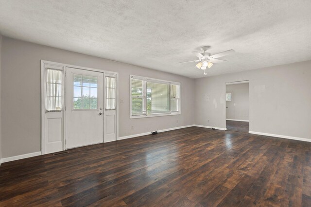 foyer with a textured ceiling, wood-type flooring, and ceiling fan