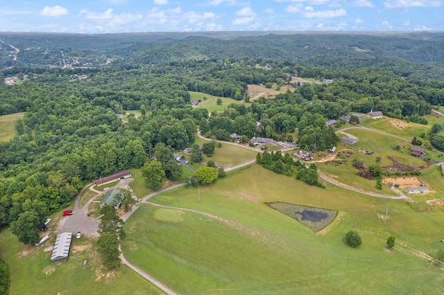 birds eye view of property with a wooded view