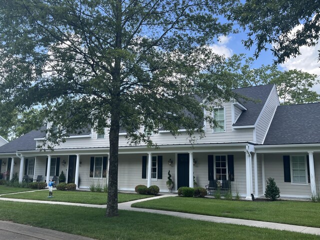 view of front of home with a front lawn and covered porch