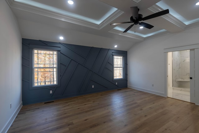 unfurnished room with beam ceiling, ornamental molding, wood-type flooring, and ceiling fan