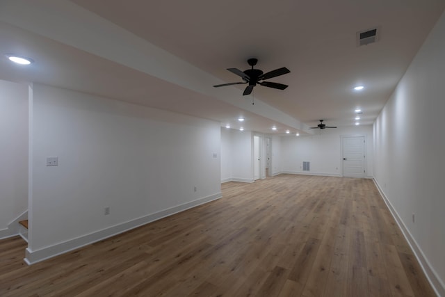 unfurnished living room featuring light hardwood / wood-style flooring and ceiling fan