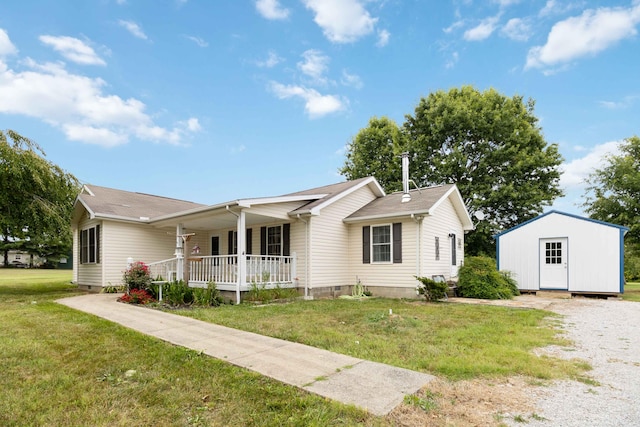 ranch-style home with a porch, a shed, and a front lawn