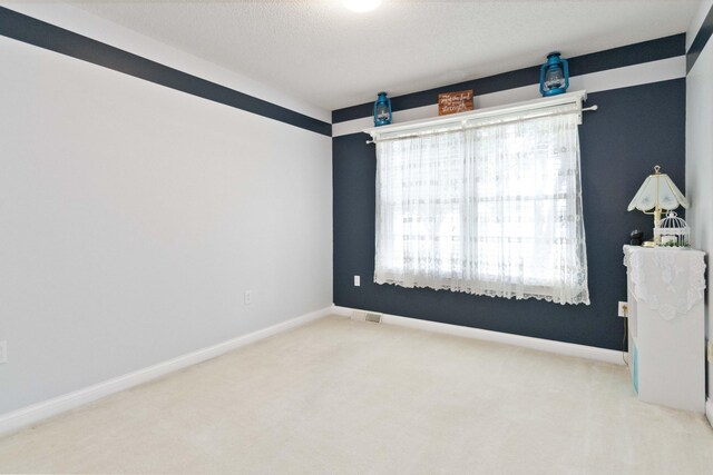 unfurnished room with carpet flooring