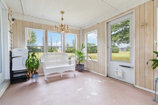 sunroom with a notable chandelier