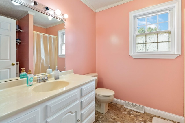 bathroom with tile patterned floors, toilet, vanity, and ornamental molding