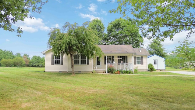 ranch-style home with a front yard and covered porch