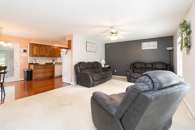 living room featuring light wood-type flooring and ceiling fan