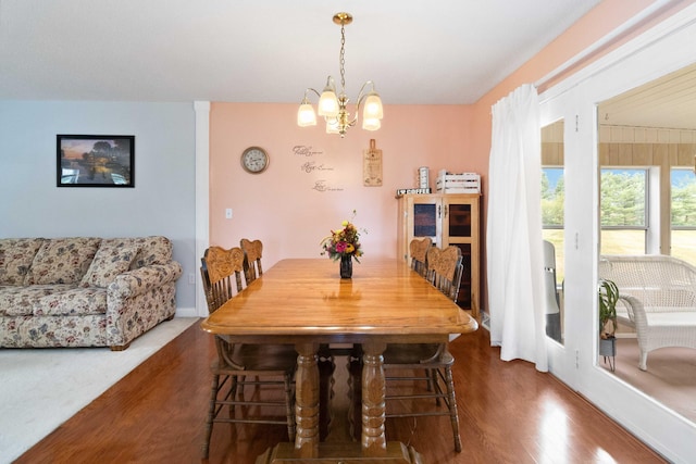 dining space featuring a chandelier and hardwood / wood-style flooring