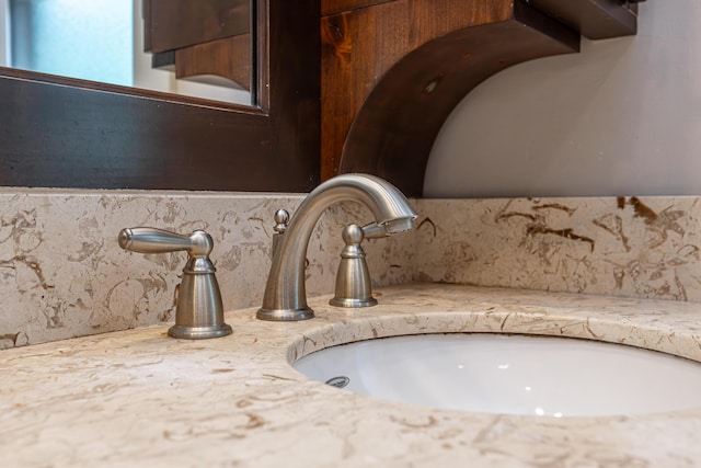 details with vanity and tasteful backsplash