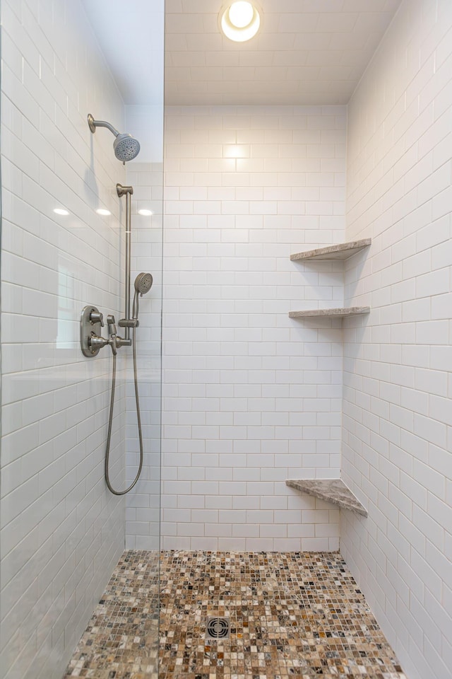 full bath featuring a tile shower