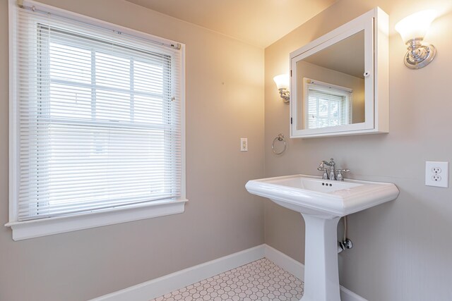 bathroom featuring a wealth of natural light and tile patterned floors