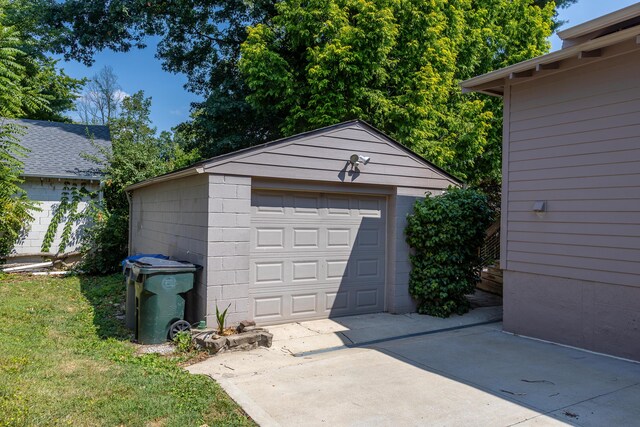 garage with a lawn