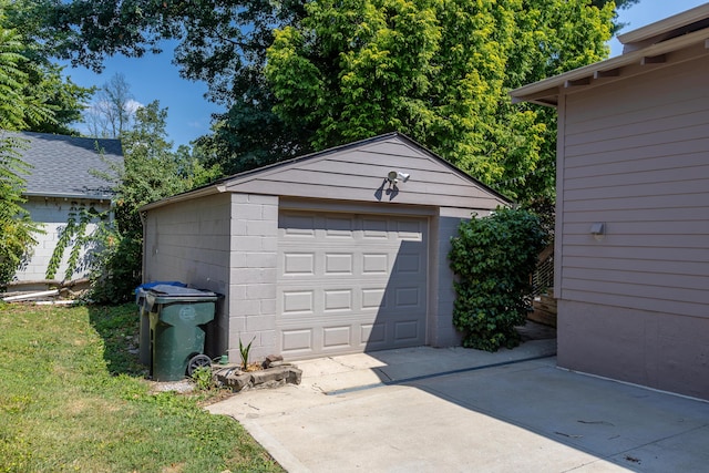 detached garage featuring driveway