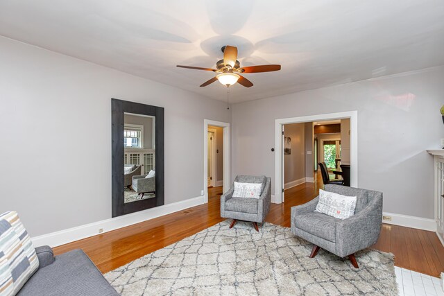 sitting room featuring hardwood / wood-style flooring and ceiling fan