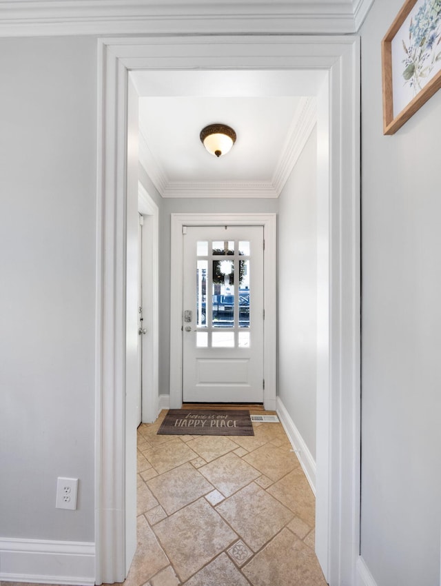 doorway to outside featuring crown molding