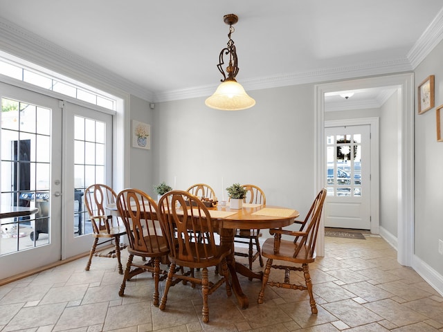 dining area featuring french doors and crown molding