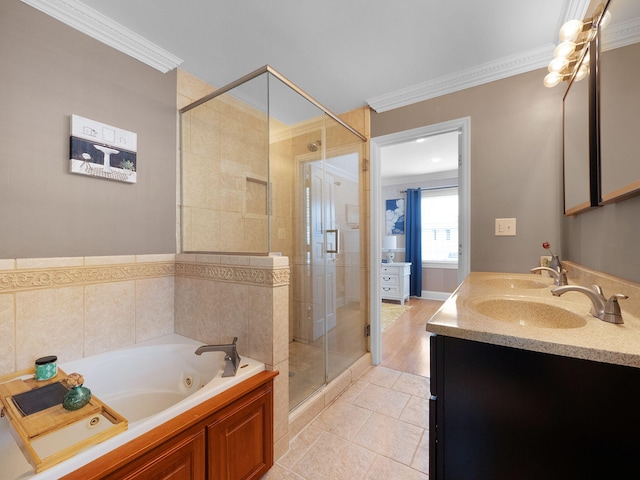 bathroom with vanity, tile patterned floors, ornamental molding, and separate shower and tub