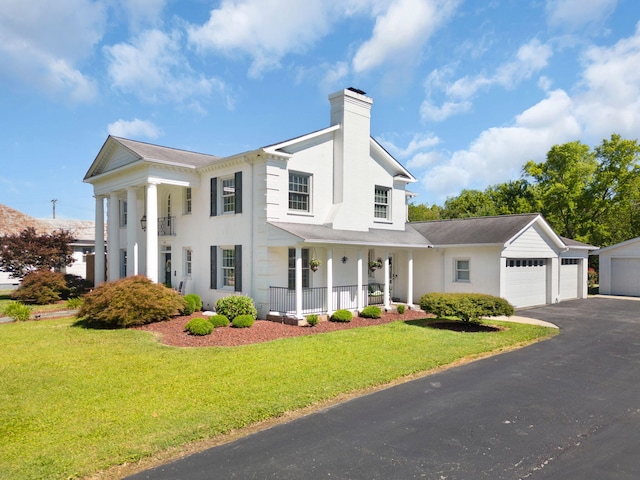 view of front of house featuring a front yard and covered porch