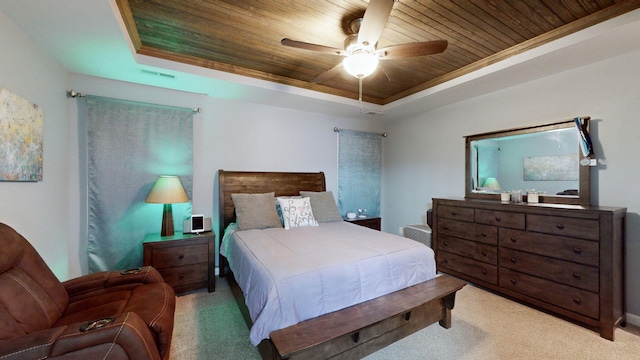 bedroom with ceiling fan, a raised ceiling, light colored carpet, and wooden ceiling