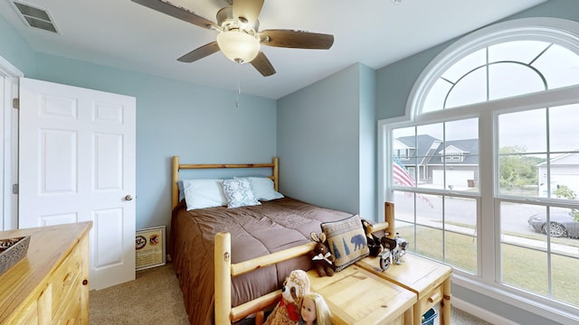 carpeted bedroom with ceiling fan