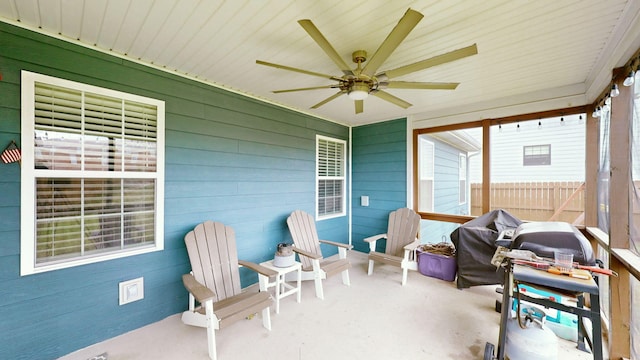 sunroom with ceiling fan and plenty of natural light