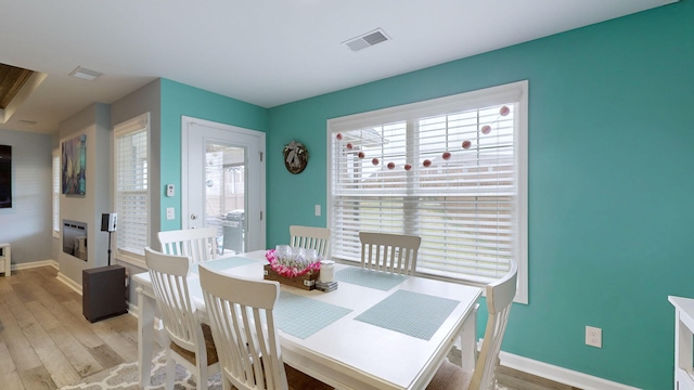 dining area featuring light wood-type flooring