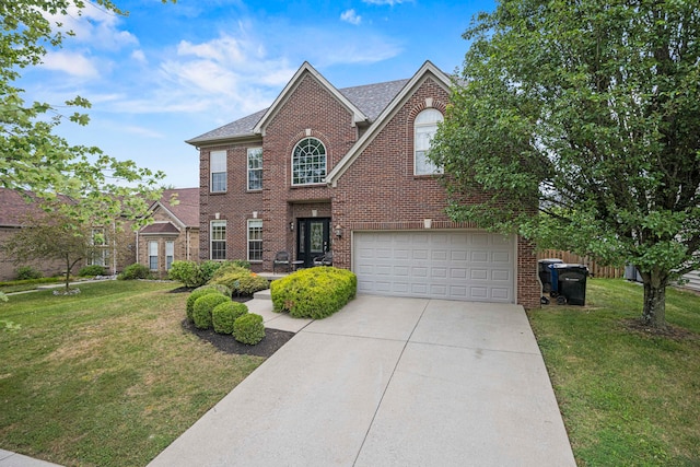 view of front of house featuring a garage and a front lawn