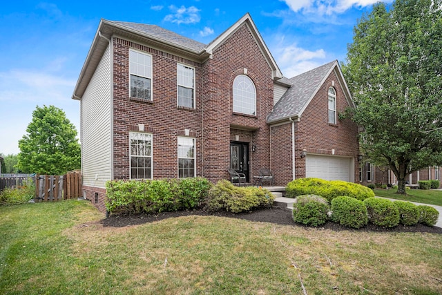 front of property featuring a garage and a front lawn