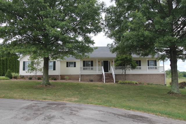 single story home featuring a porch and a front lawn