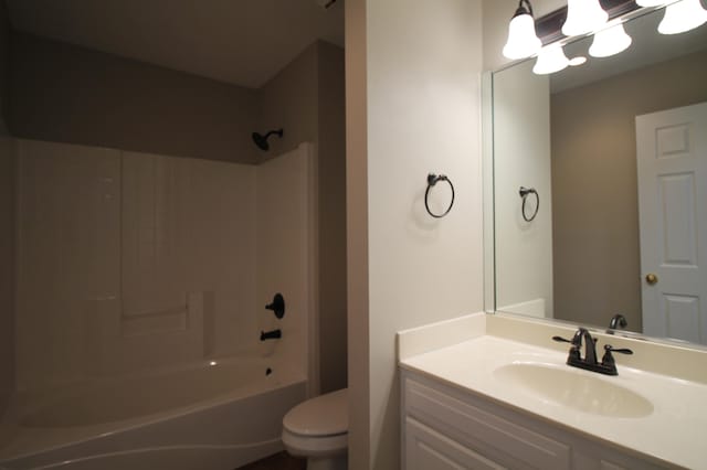 full bathroom featuring shower / washtub combination, toilet, and vanity