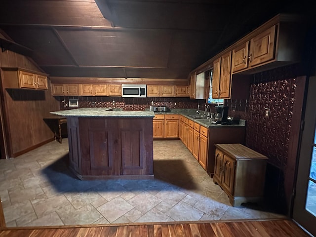 kitchen with sink and a center island