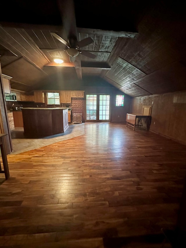 bonus room featuring ceiling fan, lofted ceiling, and dark hardwood / wood-style floors