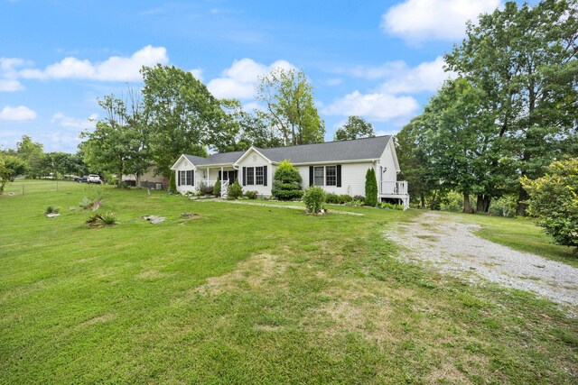 single story home featuring a front lawn